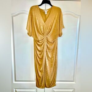 Figure skimming golden dress, knotted with a forgiving cut